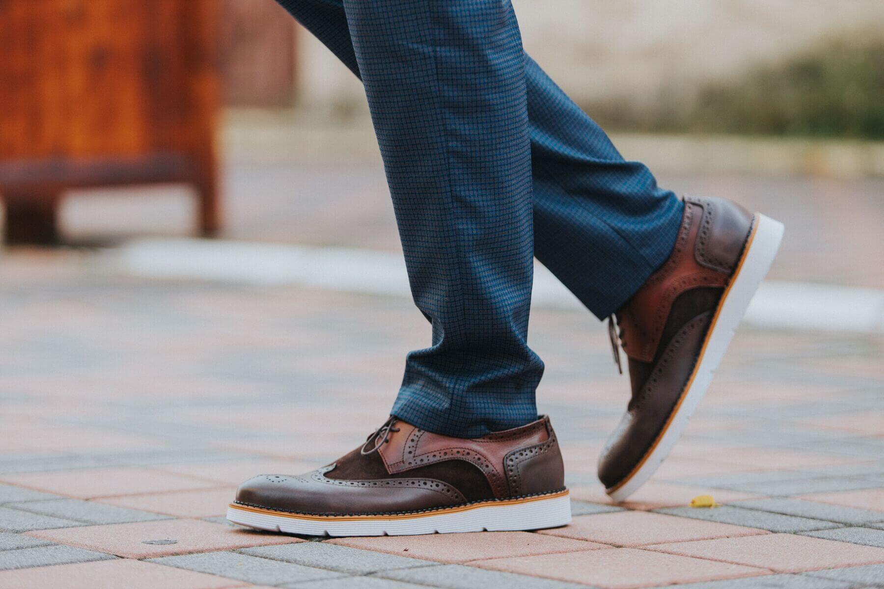 close up shot of a man wearing brown leather shoes 2023 11 27 05 33 46 utc.jpg