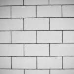 The Day I Almost Let Someone Else's Money Make Me Forget My Own Progress Close-up of a monochrome white brick wall texture, perfect for architectural backgrounds.